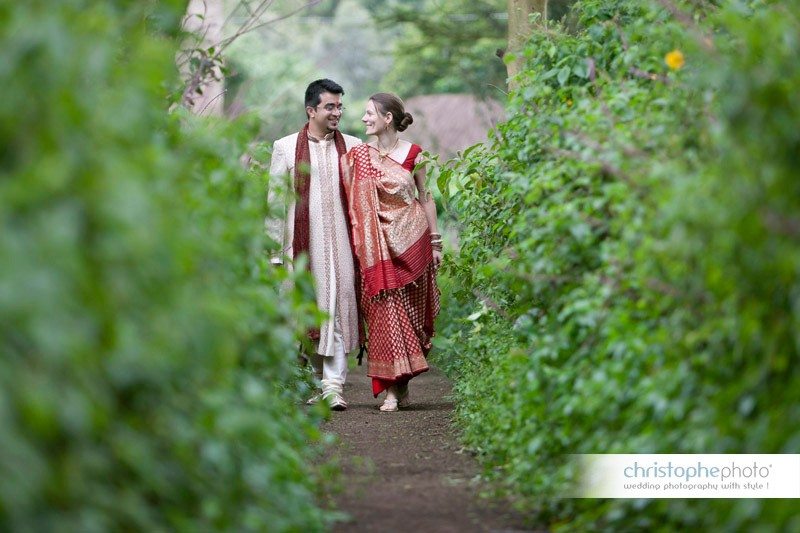 bride and groom walking in the bush.