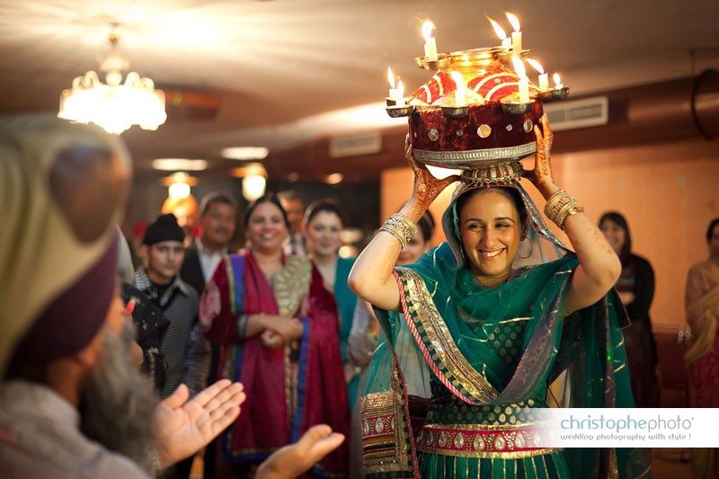 the jagoo ceremony is a candle light fire dance. Captured by Wedding Photographer Punjab India