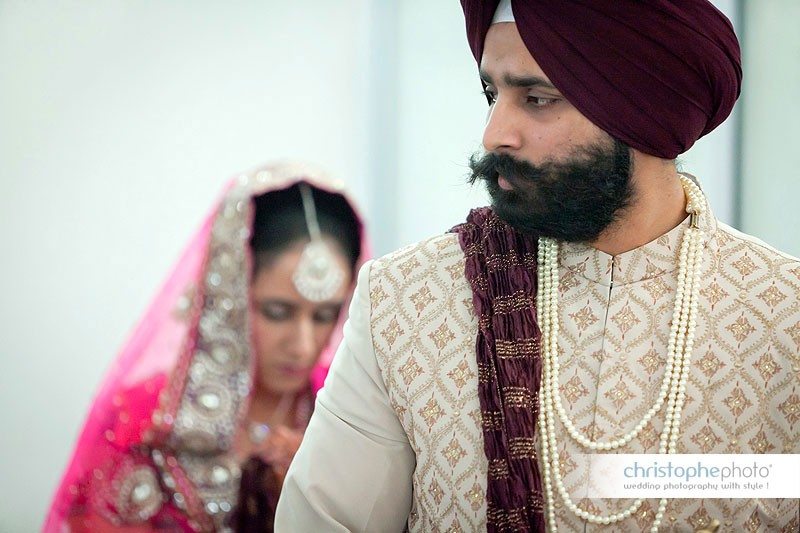 Bride and Groom walking around the guru during the Sikh wedding ceremony, chandigarh, punjab, india