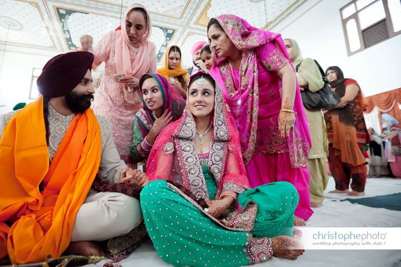 In the temple during the Sikh wedding ceremony in chandigarh, punjab, india