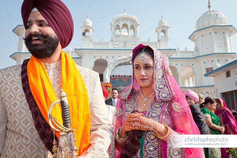 Sikh bride and groom as officially husband and wife. Walking out the temple in chandigarh, punjab, india