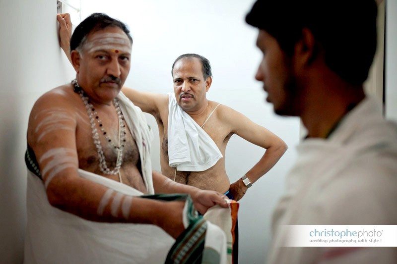 The father of the bride getting ready for the Brahmin ceremony by wedding photographer bangalore india
