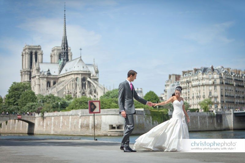 Bride and groom portrait behind Notre Dame Cathedral in Paris.