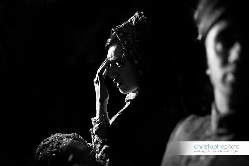 Black and white of the bride's farwell to her family after the religious ceremony. Captured by Wedding Photographer Paris Pakistan Christophe Viseux