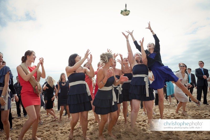 Throwing the bouquet in the air. The girls are jumping like crazy to catch it.