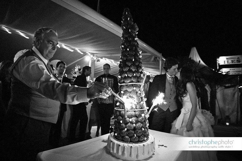 Sparklers on the wedding cake late in the evening at La Baule. Captured by Wedding Photographer France