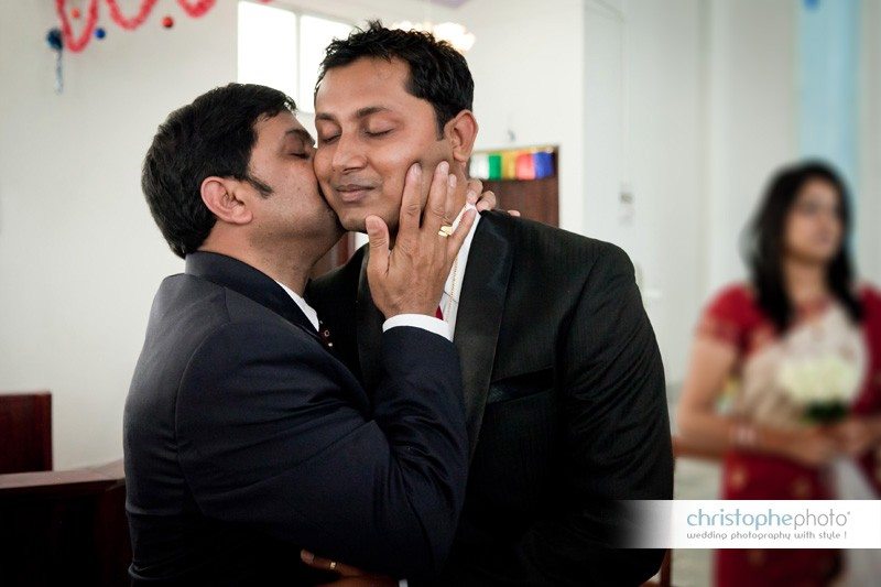 Family love after the catholic service. A very intimate moment. wedding photographer india Andaman