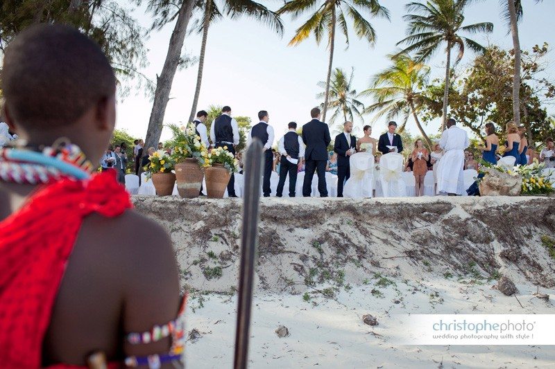 Wedding Photographer Watamu. Masai having a look at the wedding ceremony on the beach in mombasa