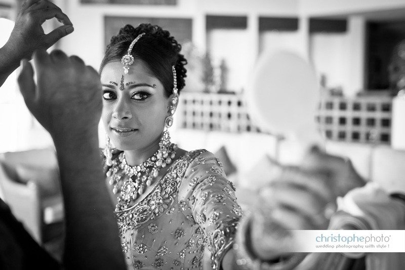 Bride looking in the mirror.