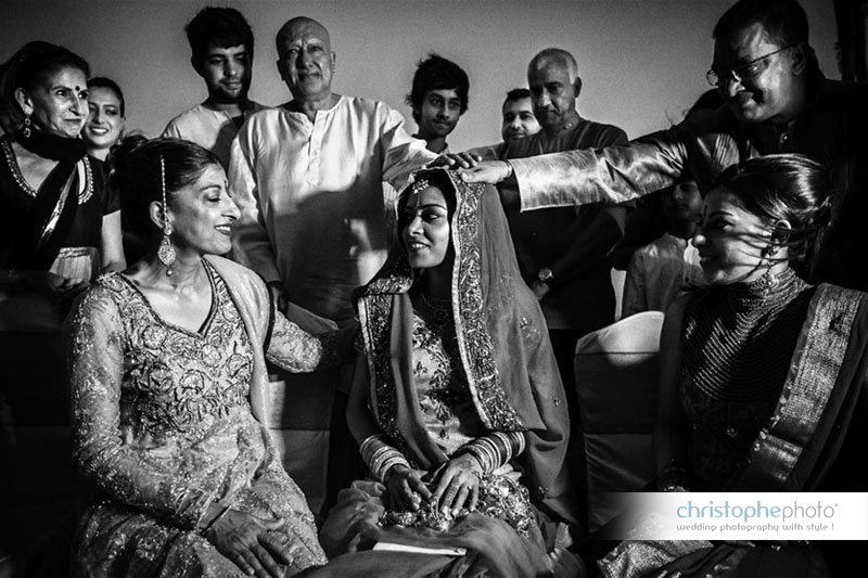 A black and white shot of the Chunni ceremony on the beach.