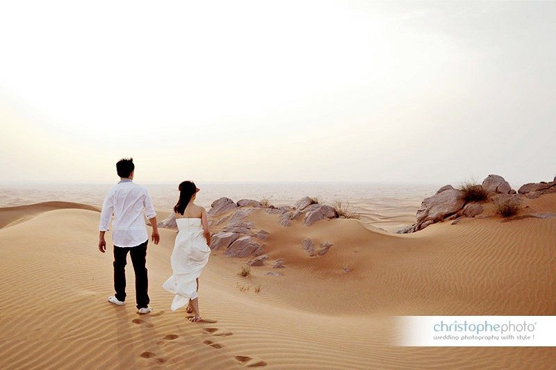 Rear view of the wedding couple looking out the desert landscapes during the PreWedding Photography Dubai Abu Dhabi