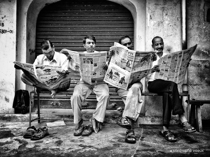 Reading the newspaper next to Samode Palace near Jaipur