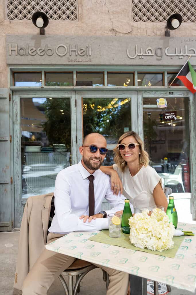 couple at a cafe during their engagement session in the UAE