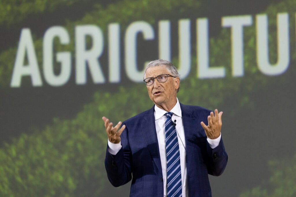 Bill Gates speaking on stage during COP28 in Dubai